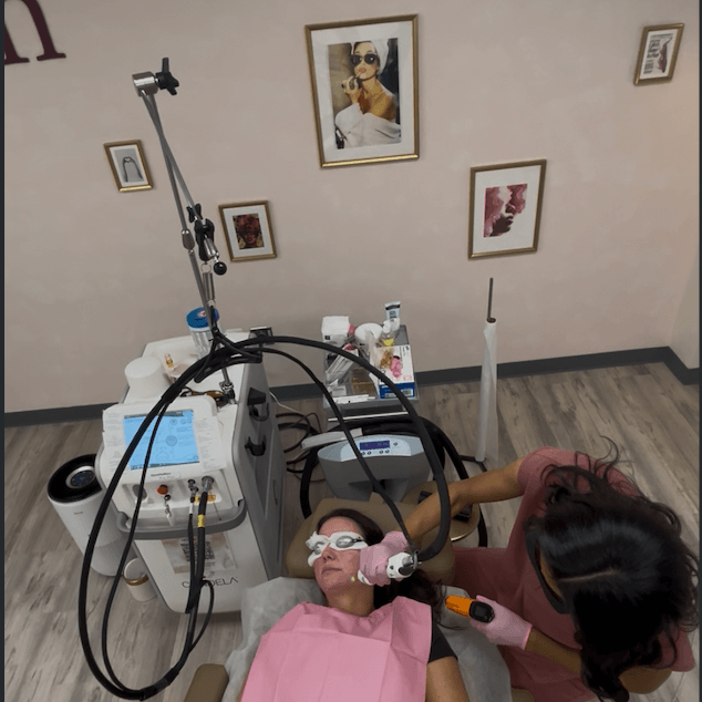 Happy woman smiling in bikini bottoms at the beach after getting laser hair removal done and not having to worry about ingrown hairs.